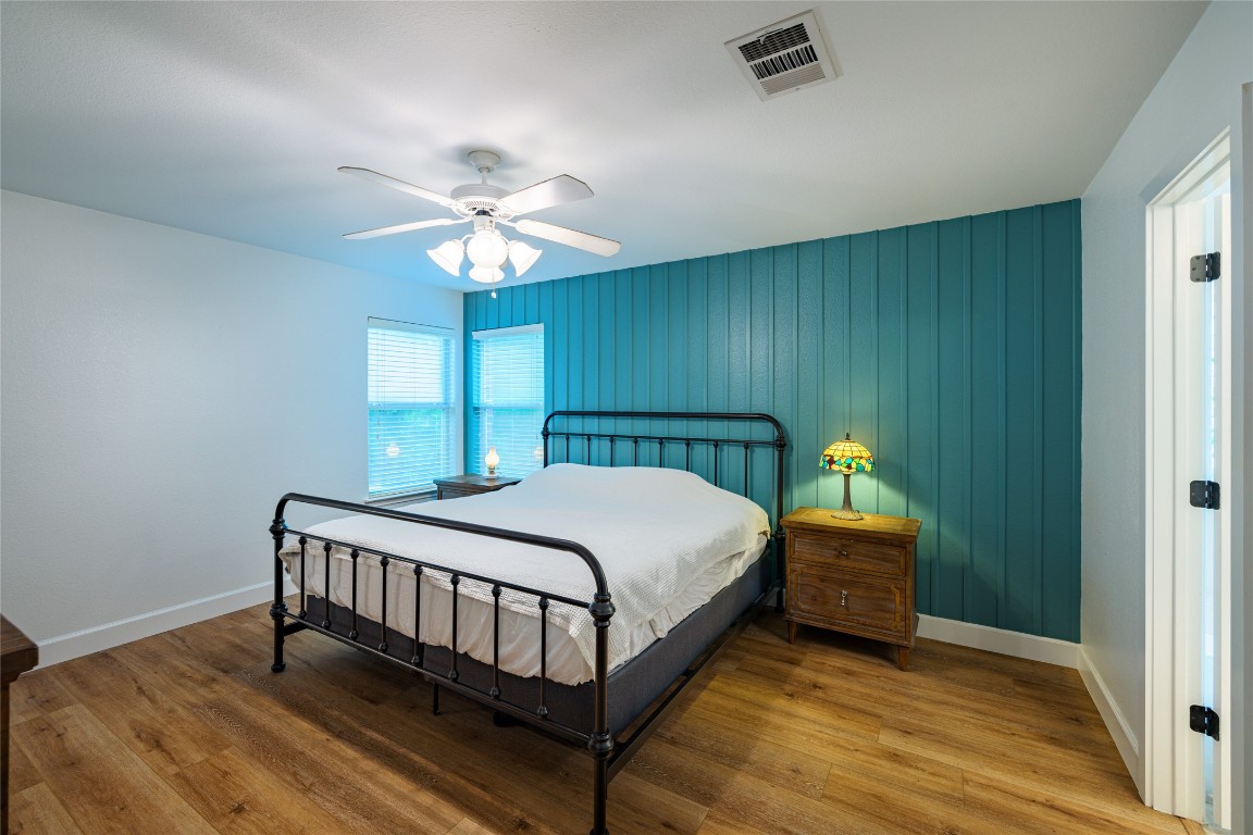 1130 Sundrop Place Round Rock, TX 78665 - Photo 9 of 18 a bedroom with a bed and a chandelier