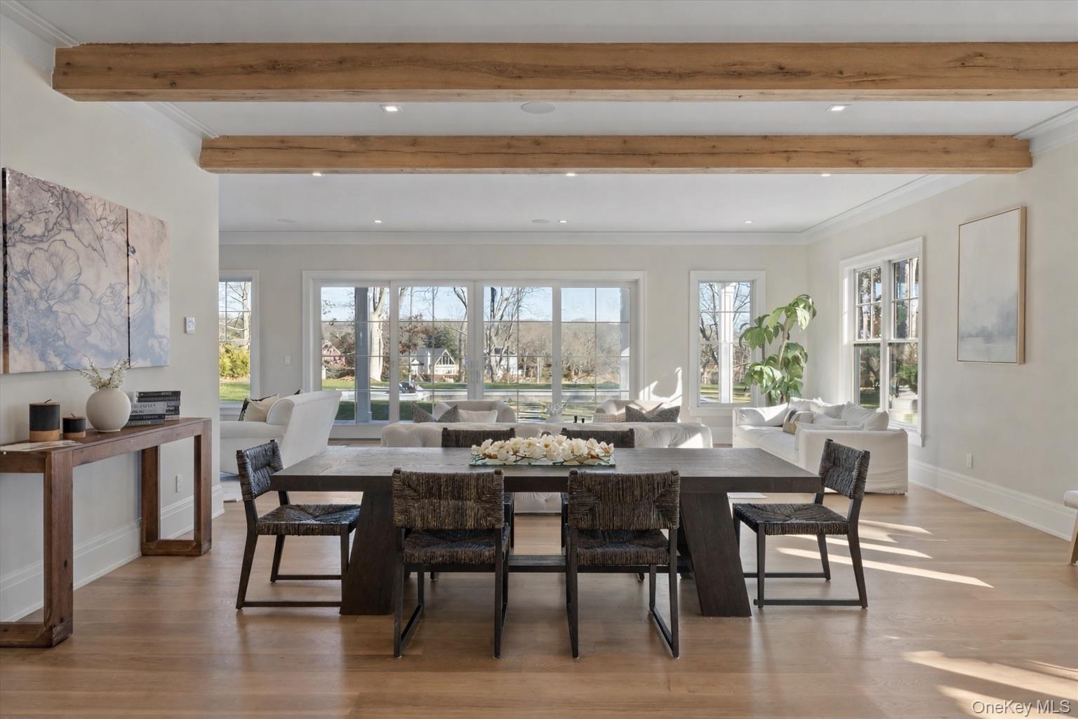 2590 Cox Neck Road Mattituck, NY 11952 - Photo 10 of 50 An elegant dining space perfectly positioned to capture water views, ideal for hosting gatherings large or intimate