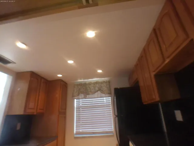 a view of a hallway with a window