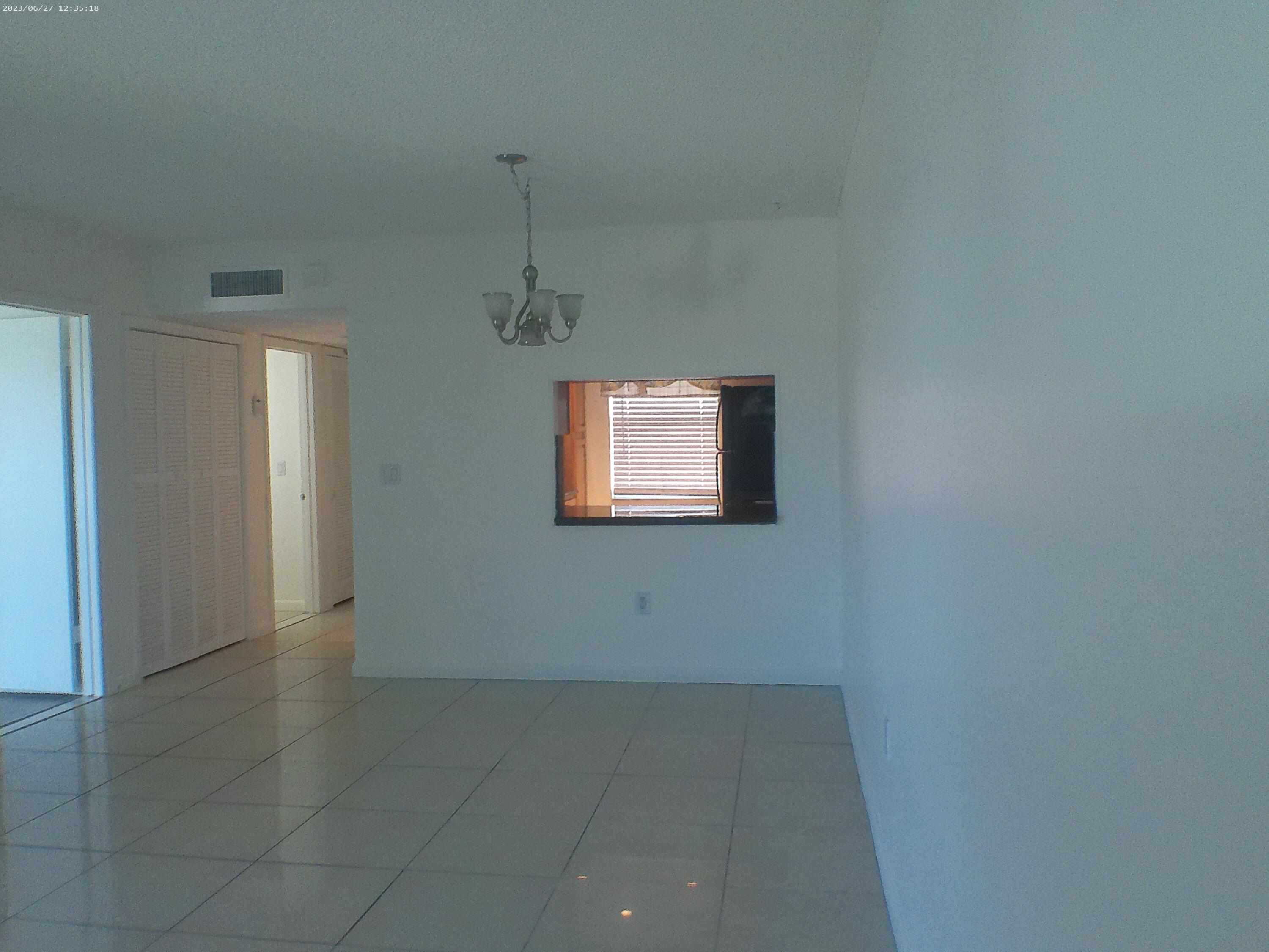 9872 Marina Boulevard, Unit 1434 Boca Raton, FL 33428 - Photo 31 of 63 a view of an empty room with a window