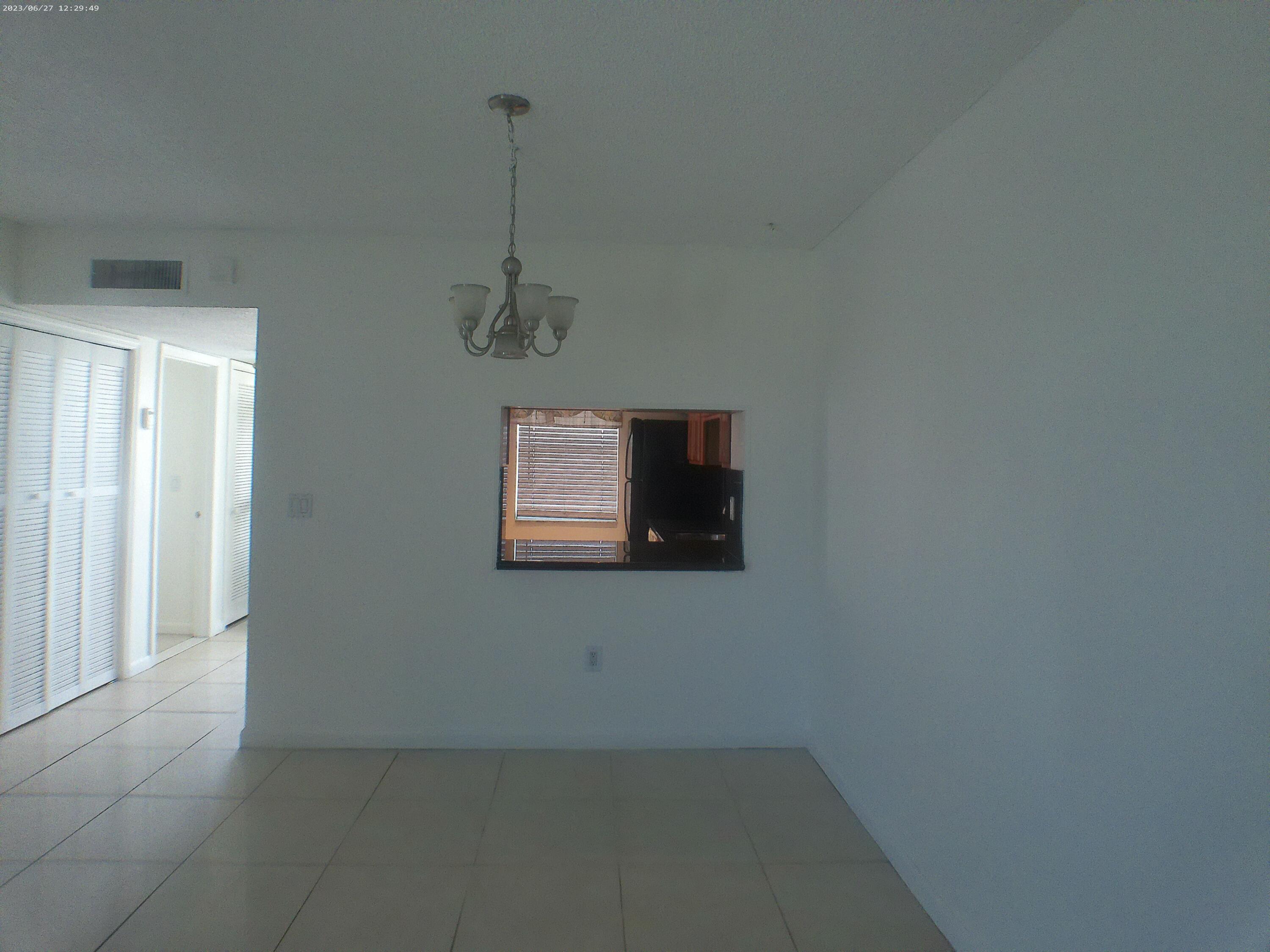 9872 Marina Boulevard, Unit 1434 Boca Raton, FL 33428 - Photo 32 of 63 an empty room with a window