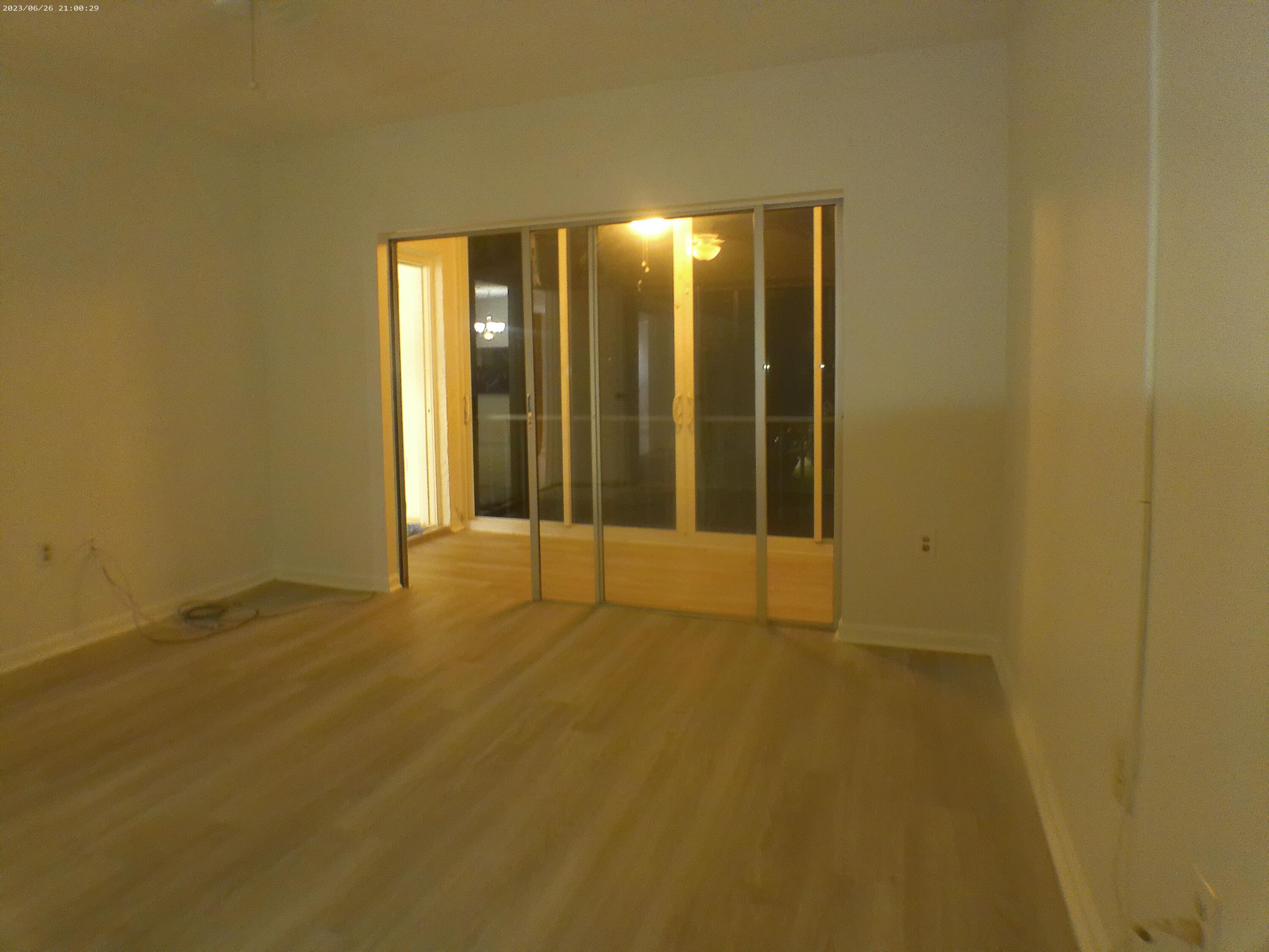 9872 Marina Boulevard, Unit 1434 Boca Raton, FL 33428 - Photo 36 of 63 a view of an empty room with wooden floor