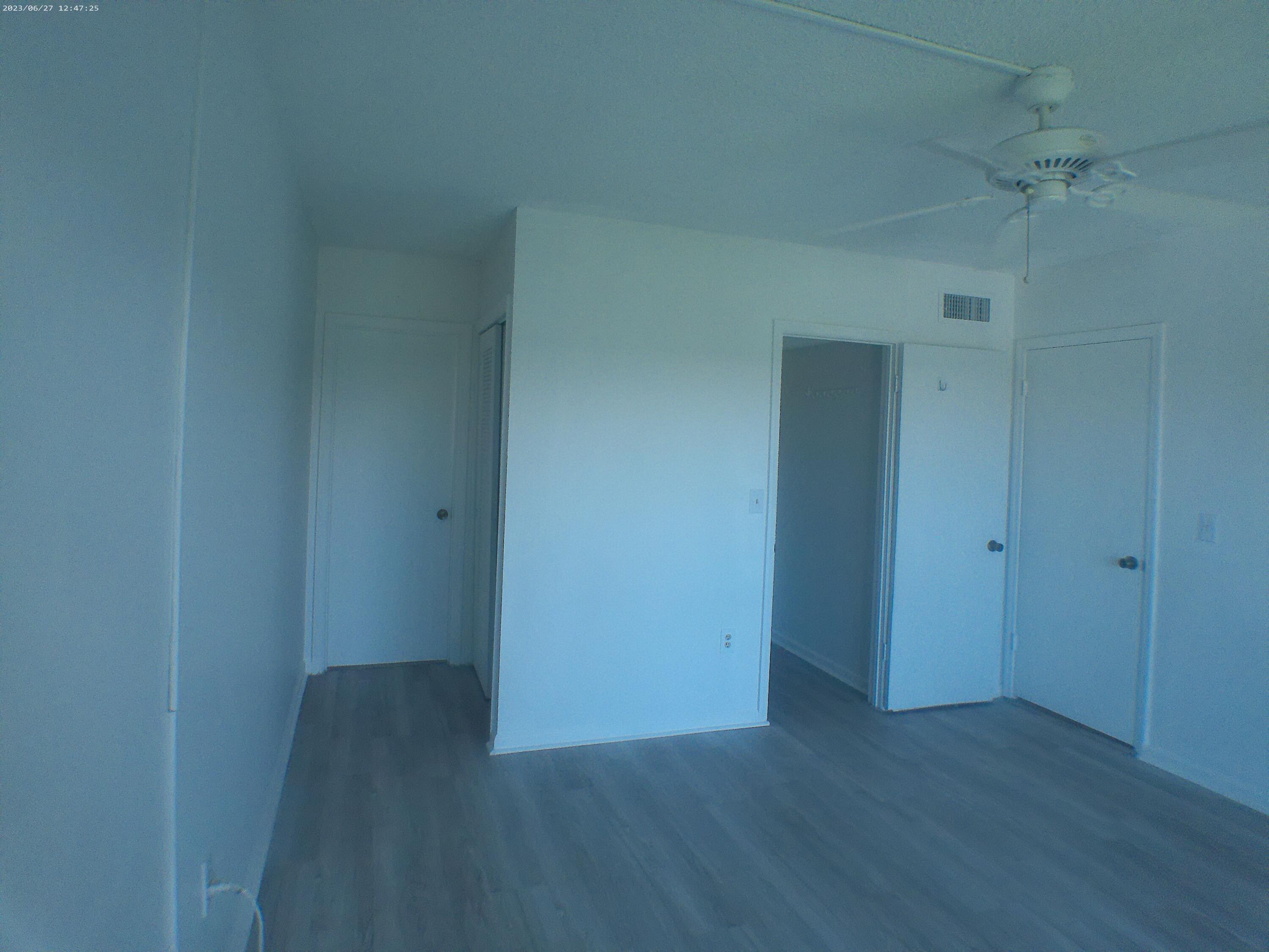 9872 Marina Boulevard, Unit 1434 Boca Raton, FL 33428 - Photo 41 of 63 a view of a hallway with wooden floor