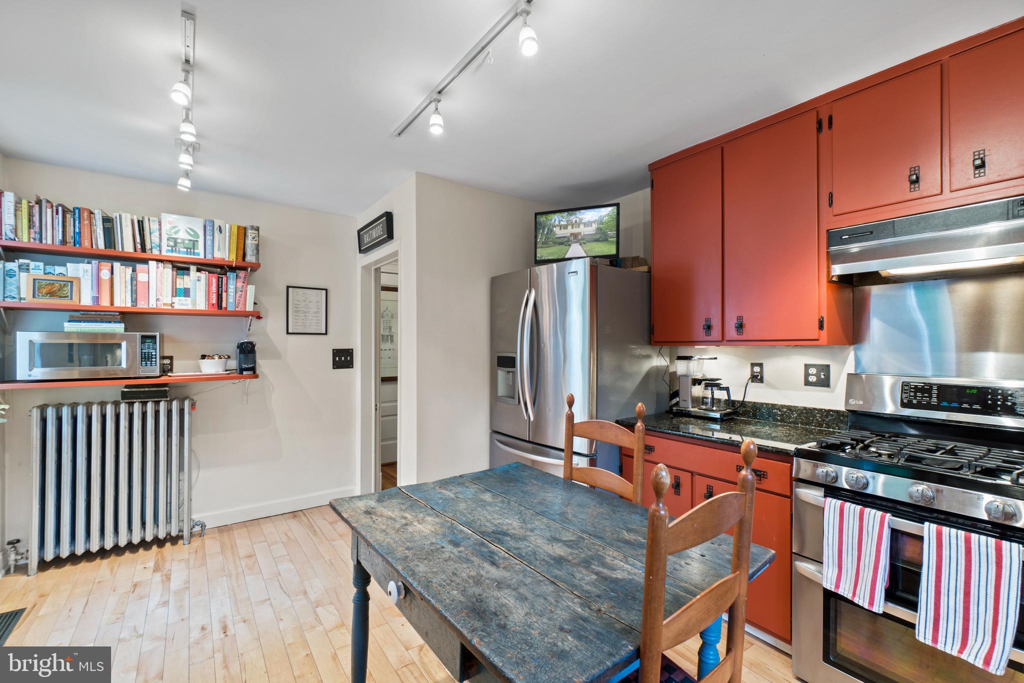 5015 Falls Rd Terrace Baltimore, MD 21210 - Photo 23 of 71 Kitchen has pine wood flooring and track lighting