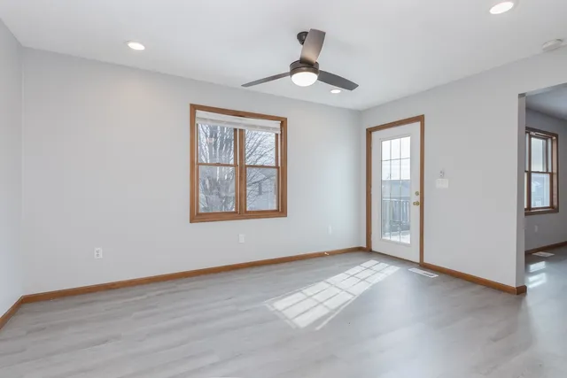 a view of livingroom with window ceiling fan and hardwood floor