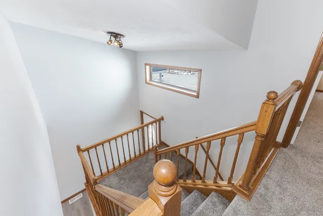 a view of entryway with stairs and front door