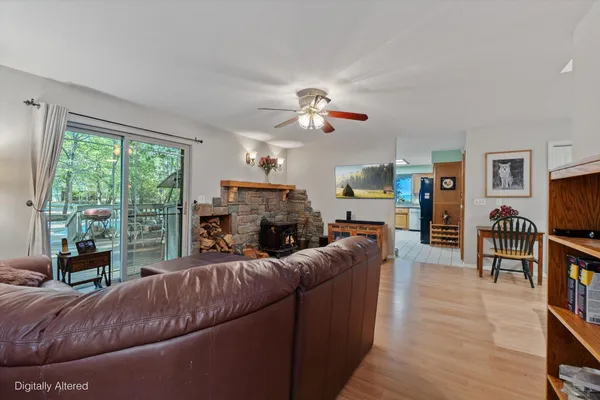 a kitchen with stainless steel appliances granite countertop a stove a sink dishwasher and a microwave oven with cabinets
