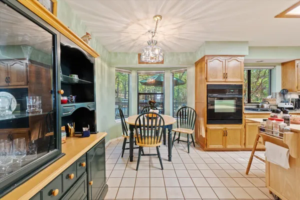 a kitchen with a stove a sink a refrigerator and a microwave