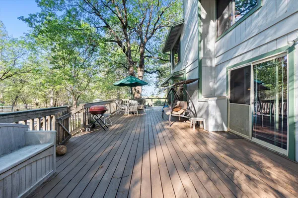 a backyard of a house with a yard and outdoor seating