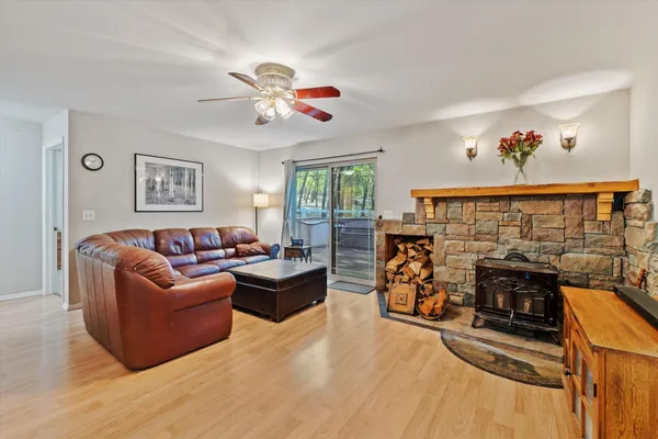 a view of a living room with furniture and flat screen tv