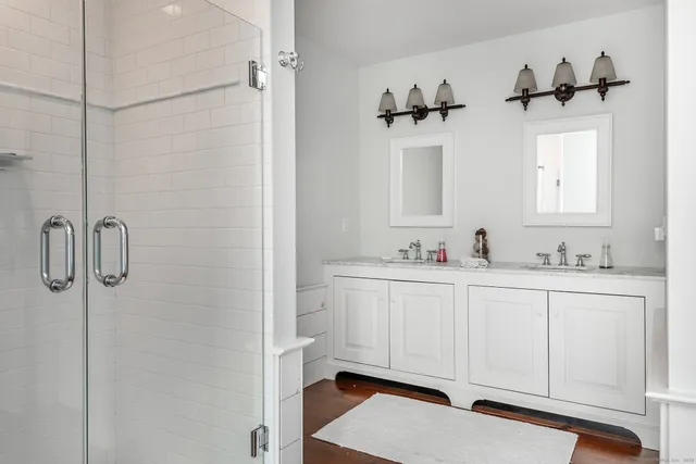 a bathroom with a sink and mirror