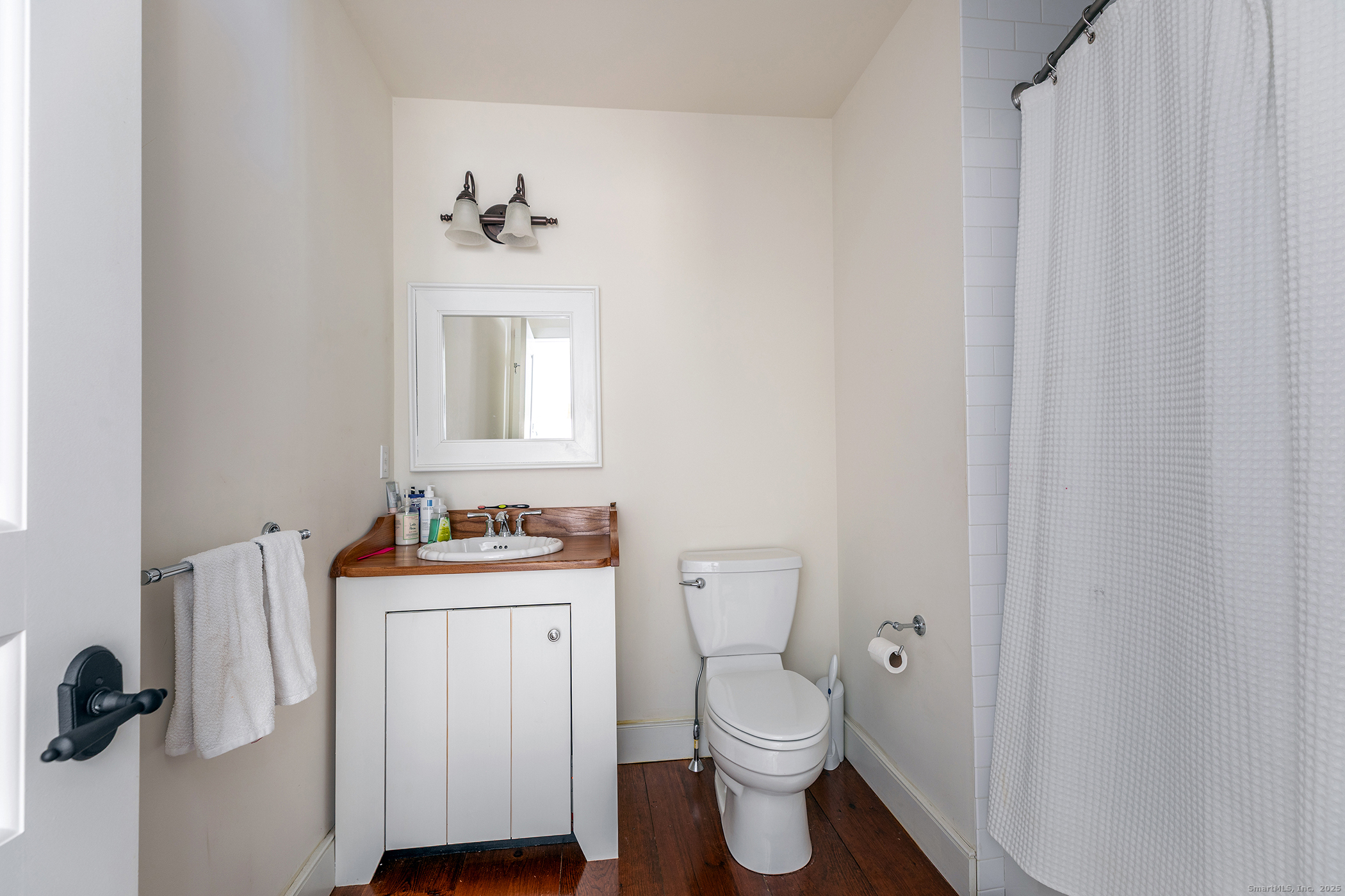 109 Dibble Hill Road Cornwall, CT 06796 - Photo 16 of 23 a bathroom with a sink a mirror and a toilet