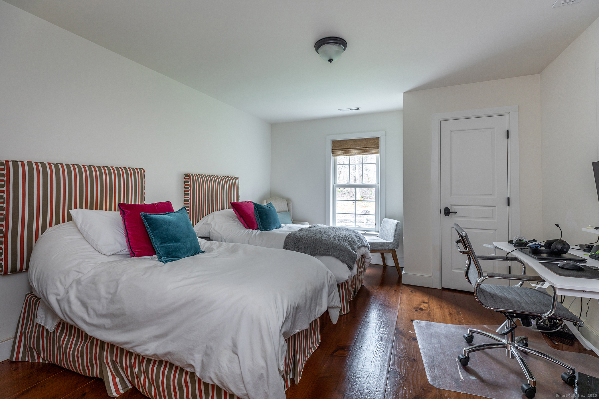 109 Dibble Hill Road Cornwall, CT 06796 - Photo 17 of 23 a bedroom with a bed and wooden floor