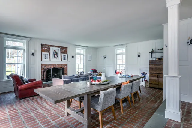 a view of a livingroom with furniture and a fireplace