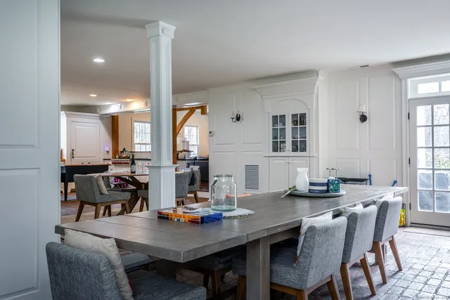 a view of a dining room with furniture and window