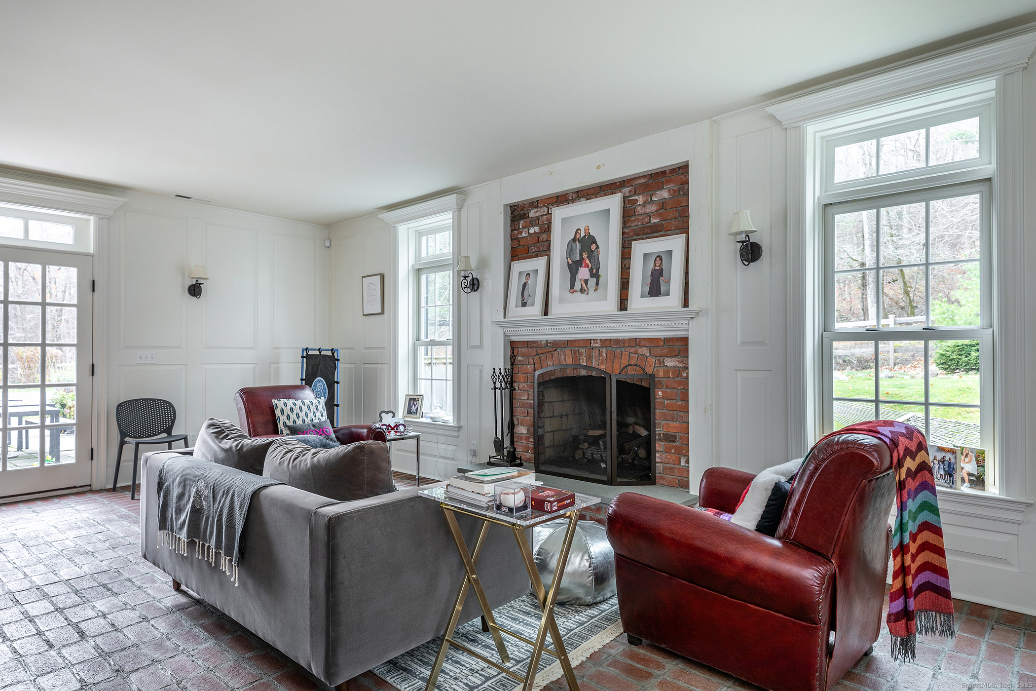 109 Dibble Hill Road Cornwall, CT 06796 - Photo 6 of 23 a living room with furniture a large window and a fireplace