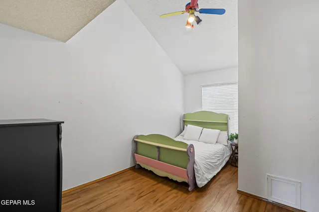 a bedroom with a workspace