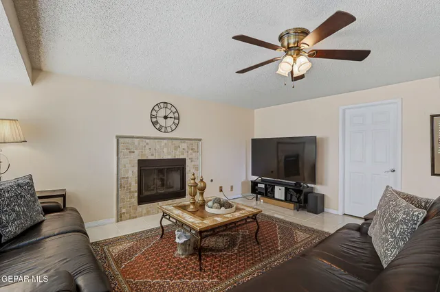 a living room with furniture and a fireplace