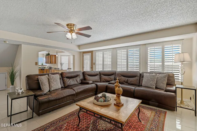 a bathroom with a granite countertop toilet sink and mirror