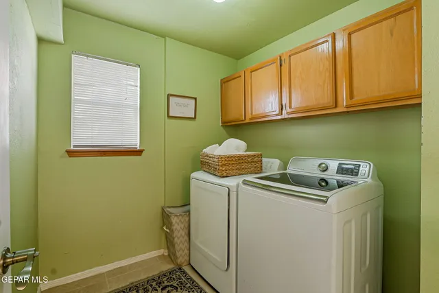 a room with granite countertop kitchen island stainless steel appliances and furniture