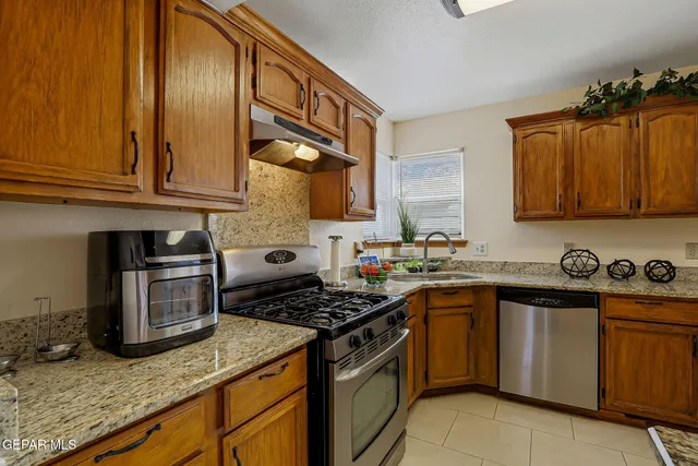 a dining room with furniture entryway and wooden floor