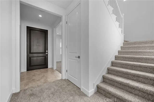 a view of an entryway with wooden floor