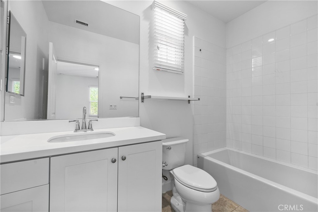82 Meander Irvine, CA 92620 - Photo 21 of 32 a bathroom with a sink a toilet and a bathtub