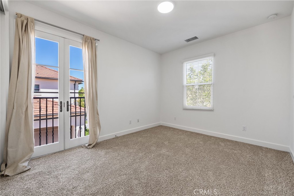 82 Meander Irvine, CA 92620 - Photo 23 of 32 an empty room with windows