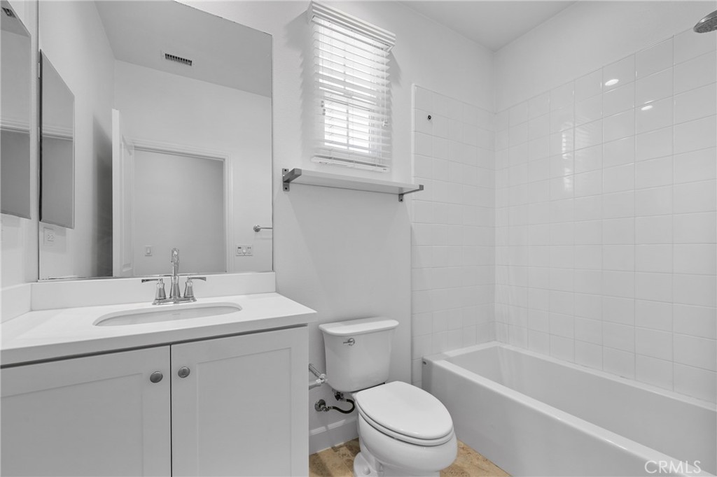 82 Meander Irvine, CA 92620 - Photo 24 of 32 a bathroom with a sink toilet vanity and tub