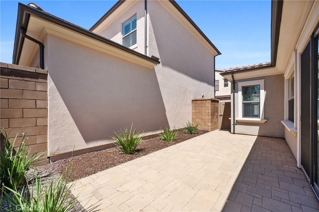 82 Meander Irvine, CA 92620 - Photo 27 of 32 a potted plant sitting on the side of a building