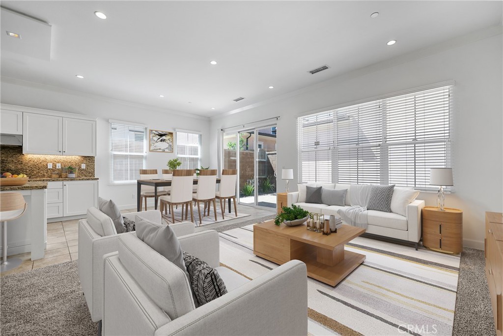 82 Meander Irvine, CA 92620 - Photo 7 of 32 a living room with furniture and a large window