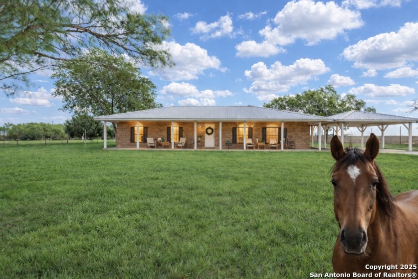 a view of a house next to a yard