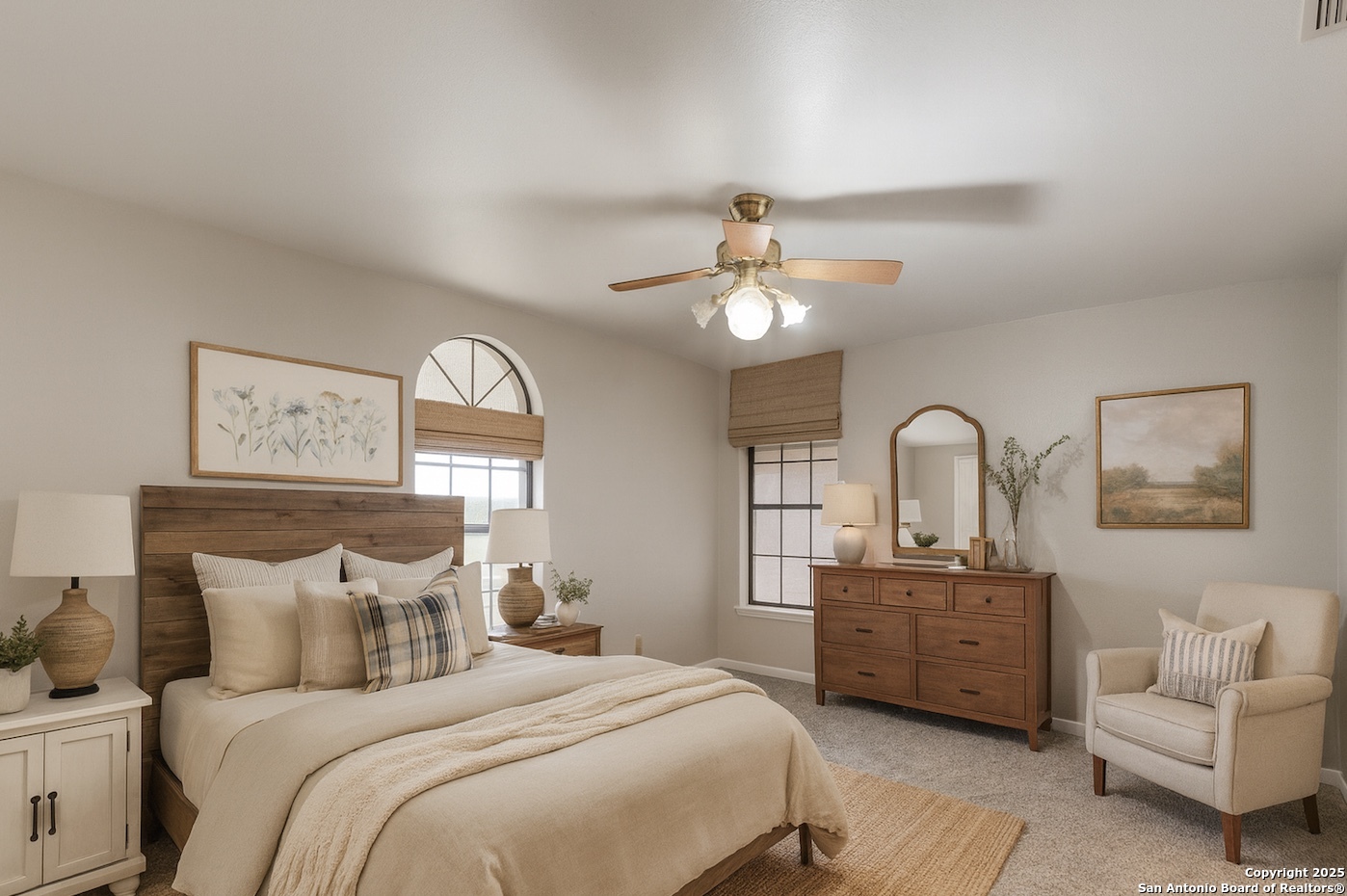315 Simon Road Pleasanton, TX 78064 - Photo 17 of 37 a bedroom with bed and a chandelier