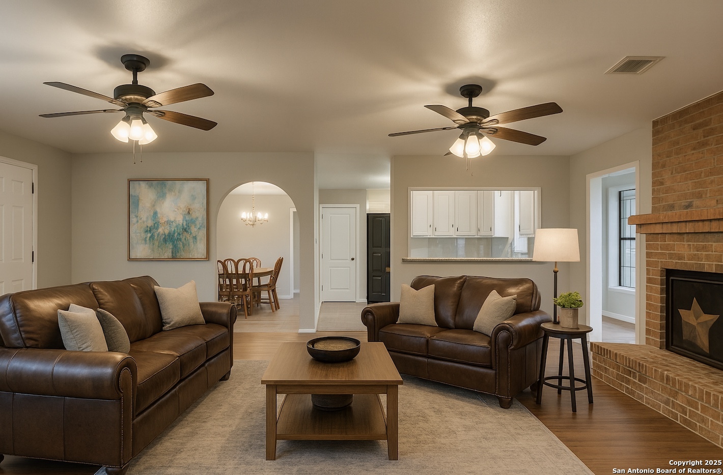 315 Simon Road Pleasanton, TX 78064 - Photo 2 of 37 a living room with furniture a fireplace and a chandelier