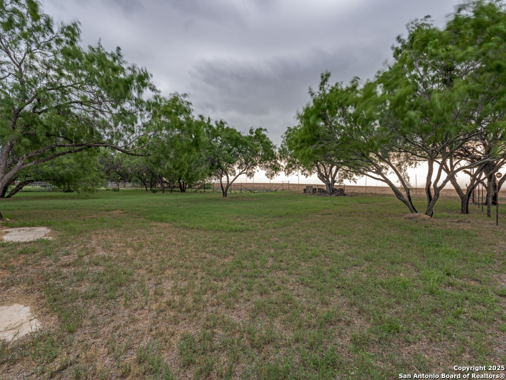 315 Simon Road Pleasanton, TX 78064 - Photo 27 of 37 a view of outdoor space with trees all around