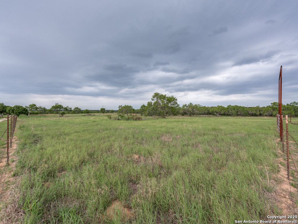 315 Simon Road Pleasanton, TX 78064 - Photo 34 of 37 a view of a lake with a yard