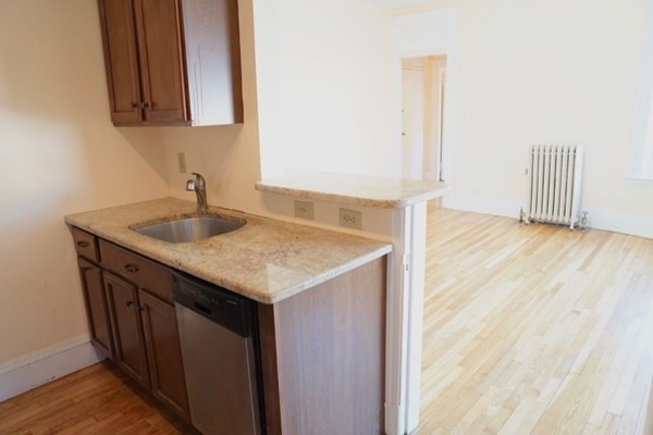 1091 Boylston Street, Unit 36 Boston, MA 02215 - Photo 3 of 7 a bathroom with a sink and a mirror