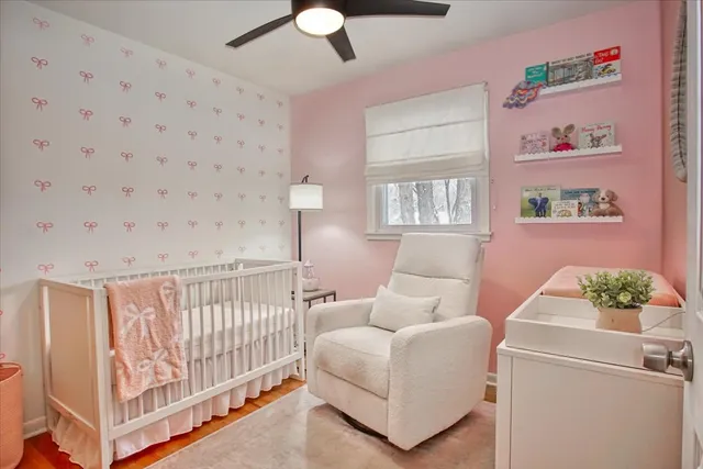 a bedroom with furniture and a window