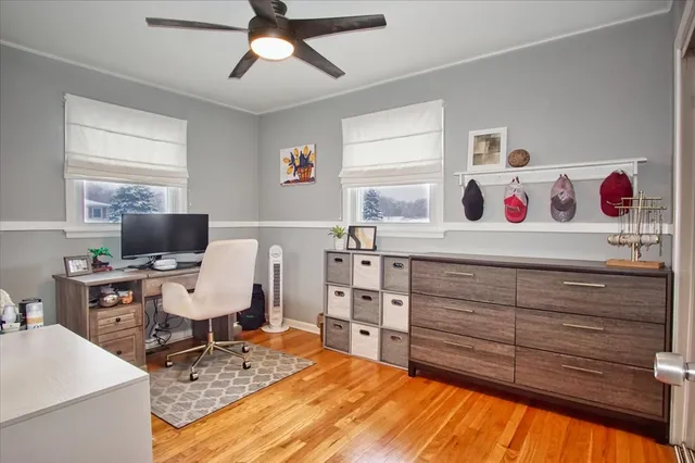 a bedroom with a bed and a desk