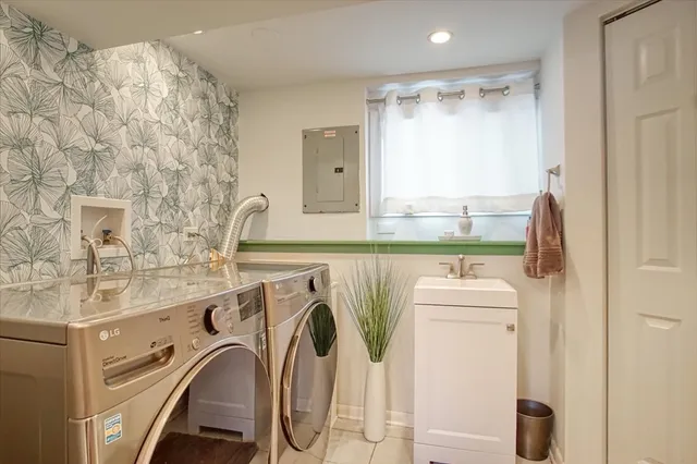 a utility room with dryer and washer