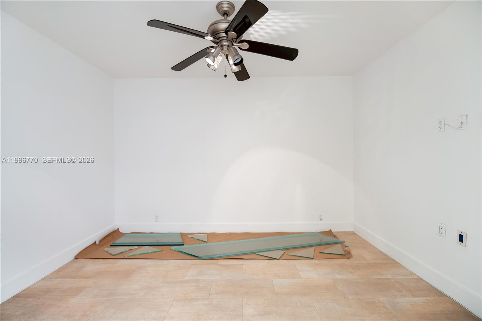 181 Crandon Boulevard, Unit 104 Key Biscayne, FL 33149 - Photo 11 of 28 a view of room with a ceiling fan