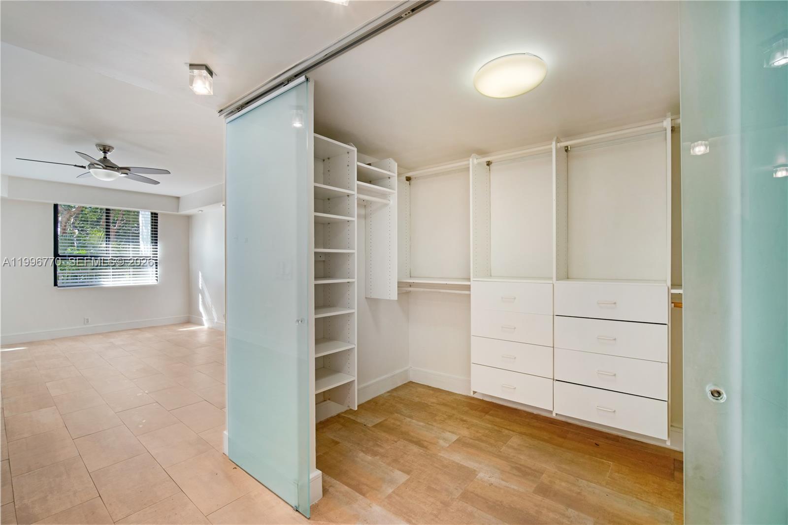 181 Crandon Boulevard, Unit 104 Key Biscayne, FL 33149 - Photo 20 of 28 a view of closet area