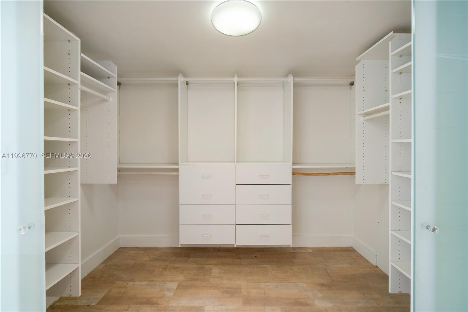 181 Crandon Boulevard, Unit 104 Key Biscayne, FL 33149 - Photo 21 of 28 a view of an empty walk in closet