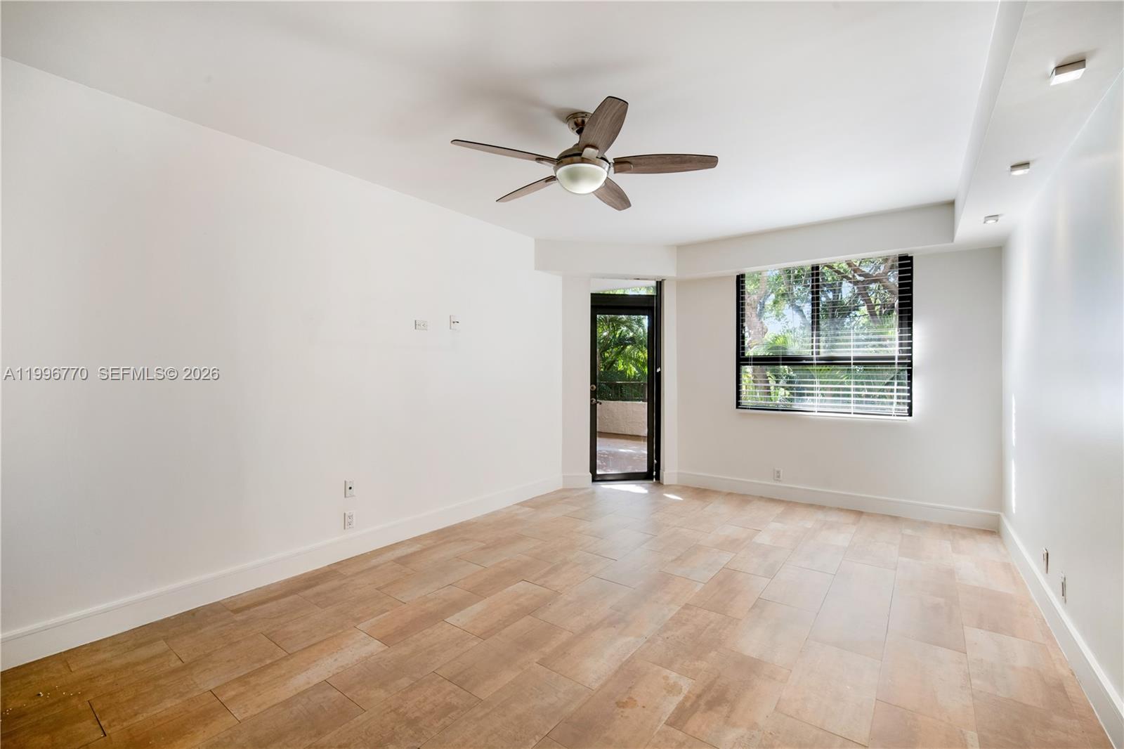 181 Crandon Boulevard, Unit 104 Key Biscayne, FL 33149 - Photo 23 of 28 a view of an empty room with a window