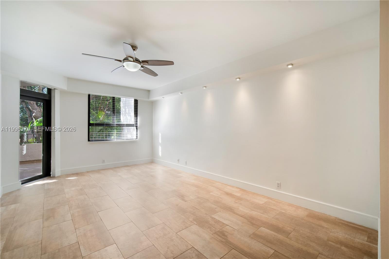 181 Crandon Boulevard, Unit 104 Key Biscayne, FL 33149 - Photo 24 of 28 a view of an empty room with a window