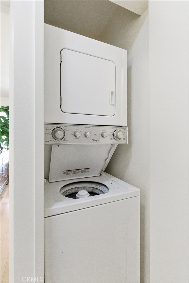 7735 Briarglen Loop, Unit I Stanton, CA 90680 - Photo 17 of 32 a utility room with dryer and washer