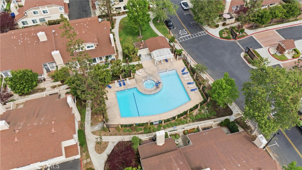 7735 Briarglen Loop, Unit I Stanton, CA 90680 - Photo 30 of 32 an aerial view of a house with a swimming pool