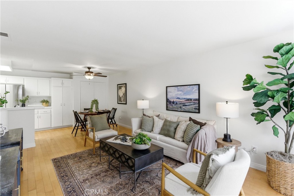 7735 Briarglen Loop, Unit I Stanton, CA 90680 - Photo 5 of 32 a living room with furniture and a rug