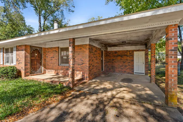 a living room with stainless steel appliances kitchen island granite countertop furniture and a kitchen view