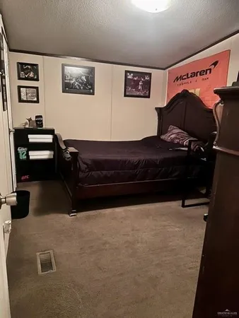 a bedroom with a bed and cabinets